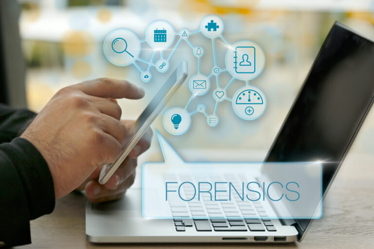 Close up of a person on a tablet at a laptop with data forensics icons