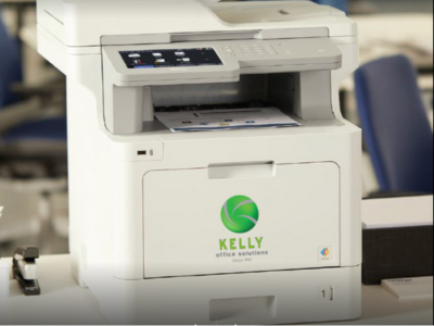 A laser printer in our Charlotte office with the Kelly logo on the front.