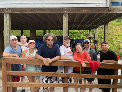A picture of eight of our Charlotte team members on a group outing. They're all smiles!